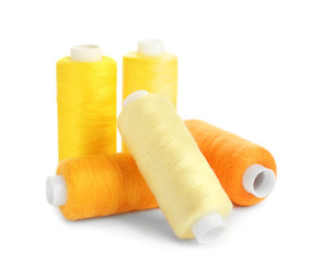 Set of sewing threads on white background