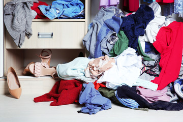 Pile of clothes on floor indoors