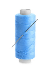 Blue thread and needle on white background
