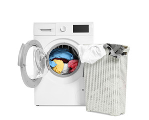 Washing machine and basket with laundry on white background