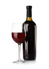 Bottle and glass with red wine on light background