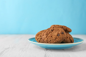 Delicious oatmeal cookies with chocolate chips on plate