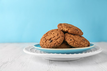 Delicious oatmeal cookies with chocolate chips on plate