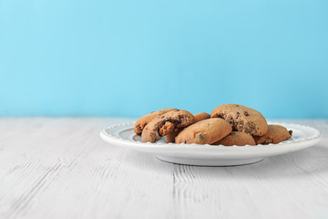 Delicious oatmeal cookies with chocolate chips on plate