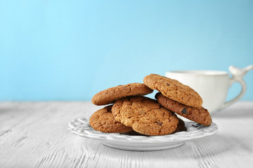 Delicious oatmeal cookies with chocolate chips on plate
