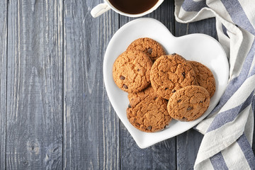 Delicious oatmeal cookies with chocolate chips on plate
