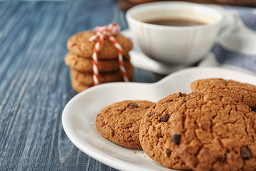 Delicious oatmeal cookies with chocolate chips on plate
