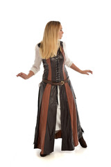 full length portrait of girl wearing brown  fantasy costume, standing pose with back to the camera...
