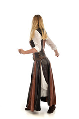 full length portrait of girl wearing brown  fantasy costume, standing pose with back to the camera on white studio background. 