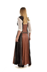 full length portrait of girl wearing brown  fantasy costume, standing pose with back to the camera on white studio background. 
