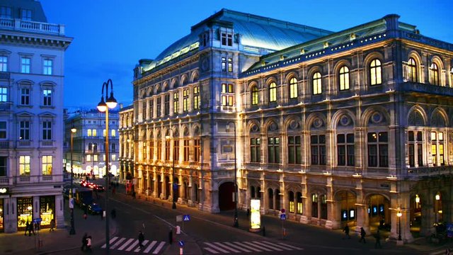Vienna, Austria. View of State Opera in Vienna, Austria during the night. Bright blue sky, car light trails