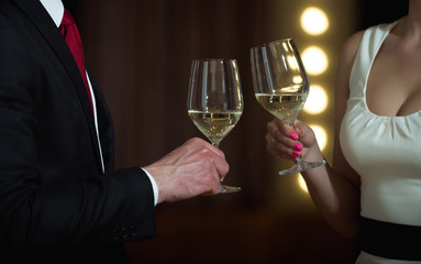 couple in love on romantic date with wine glasses