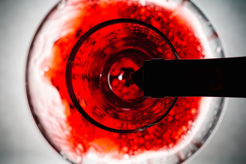 Red wine pouring in decanter
