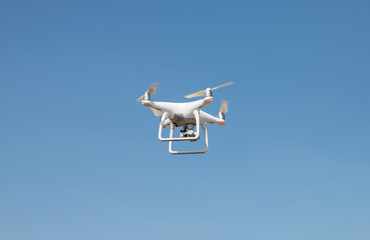 drone quadcopter hover on sky background