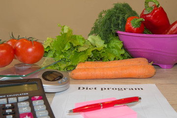 Vegetables, Libra, calculator and centimeter on a white background. Diet concept