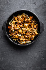 Obraz na płótnie Canvas Mushrooms fried with onion, top view