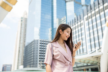 Young asian businesswoman outdoors