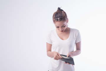 Asian Girl holding wallet and money. Woman taking out money from wallet and counting money for cash on white background,Shopping concept.