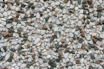 Wall with small stones as texture background.