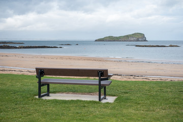 A bench, next to the sea