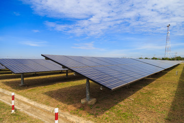 Solar energy panels against a clouds and bluesky.