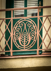 Detail of a beautiful old wrought iron balcony grid
