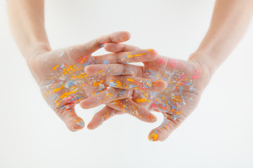 hands of artist dirty with tsuet paint, isolate on white background. place for text