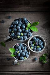 Juicy blueberry in the old metal mug