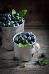 Sweet blueberry in the old metal mug