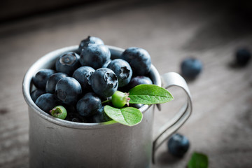 Juicy blueberry on old wooden rustic floor