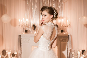 Portrait of a beautiful bride in profile from the back.