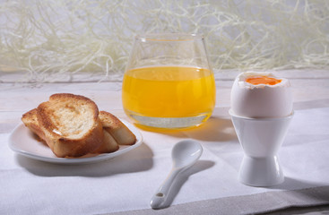 Morning Breakfast set with egg, bread toast and orange juice.