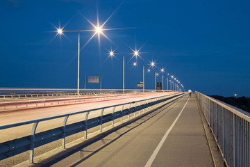 Road on bridge at night