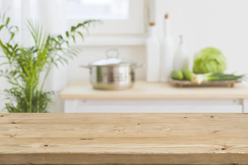Table top with blurred kitchen interior as background