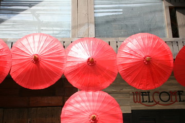 January,19,2018 red umbrellas hanging on wood at  umbrella festival