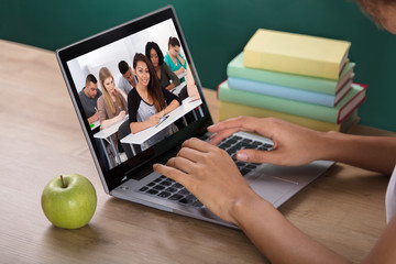 Teacher Video Conferencing With Students In Classroom