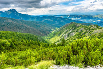 Valley and mountains, landscape with top of the mountain on the sky background