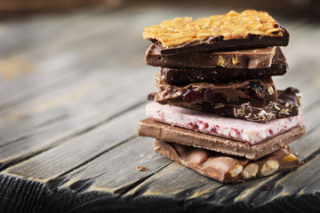 Mix of sweet swiss choccolate on the wooden table