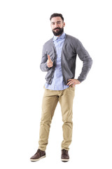 Naklejka premium Smiling stylish bearded modern business man pointing finger at you looking at camera. Full body length portrait isolated on white studio background. 
