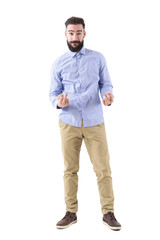 Fototapeta premium Young bearded hipster business man showing rude obscene middle finger gesture at camera. Full body length portrait isolated on white background. 