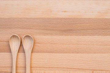 Wooden spoon on wooden background