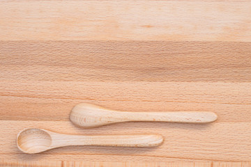 Wooden spoon on wooden background