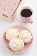 Homemade zephyr or marshmallow with coffee on white background