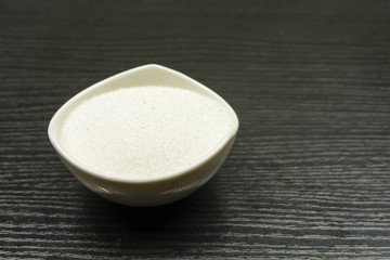 Bowl with white sugar.