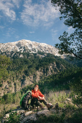 Female hiker having rest on the Lycian way to Tahtali, Turkey