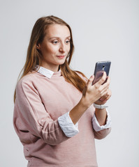 Fototapeta premium Happy woman phone talking at white studio background