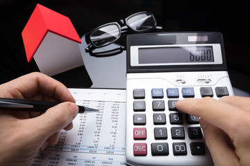Businessperson Calculating Financial Report