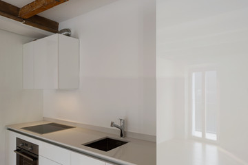 Fototapeta na wymiar Modern kitchen in renovated apartment