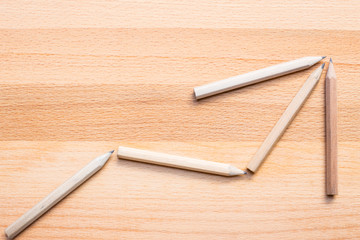 pencils on wooden background