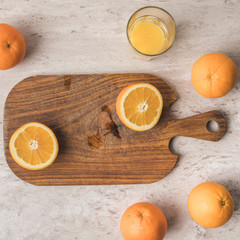 top view of cut orange on wooden board
